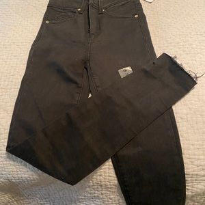 Women’s black buckle skinny jeans